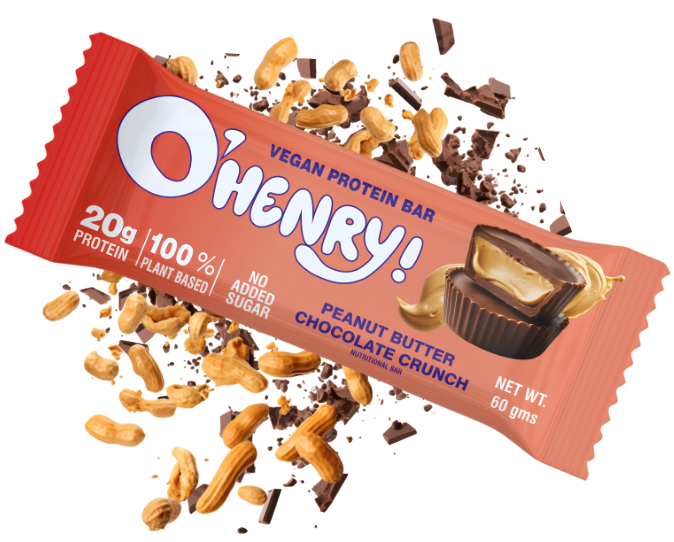 A single O'henny! Vegan Protein Bar in Peanut Butter Chocolate Crunch flavor, shown diagonally with scattered peanuts, chocolate pieces, and a chocolate cupcake illustration on a plain white background.